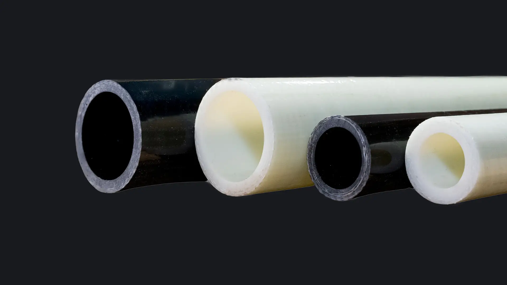 4 GRP pipes (plastic pipes made of glass fibre reinforced plastic) with different diameters and colours from Fiberpipe, a manufactorer of grp products