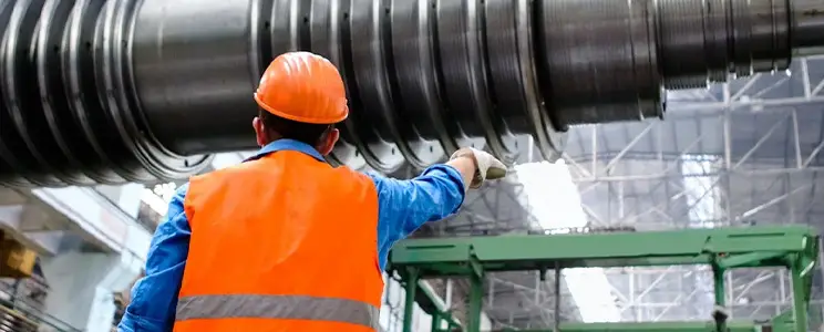 A Fiberpipe employee at work (production of GRP containers and GRP pipes)